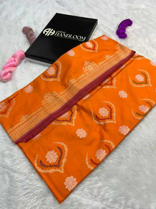 This exquisite Orange Pure Katan iktara Silk Banarasi Saree