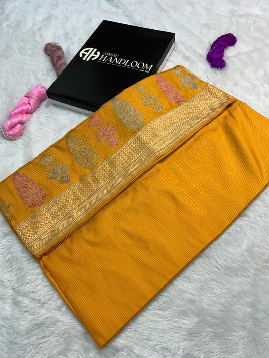 this fanta orange iktara handwoven saree with checks body pattern and beutiful minakari skirt