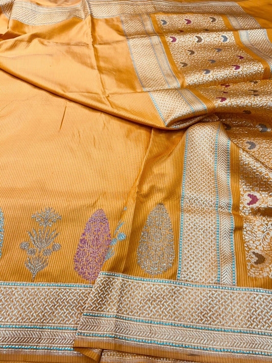 this fanta orange iktara handwoven saree with checks body pattern and beutiful minakari skirt