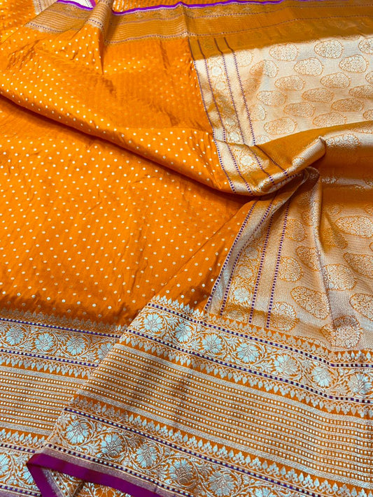 Handwoven Banarasi Katan Silk Saree in Radiant Orange with Rani Pink Selvedge and Gold Zari Buti