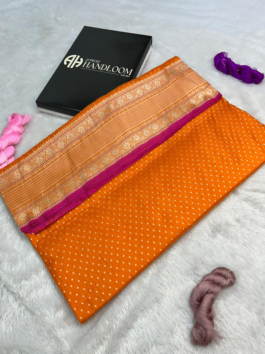Handwoven Banarasi Katan Silk Saree in Radiant Orange with Rani Pink Selvedge and Gold Zari Buti