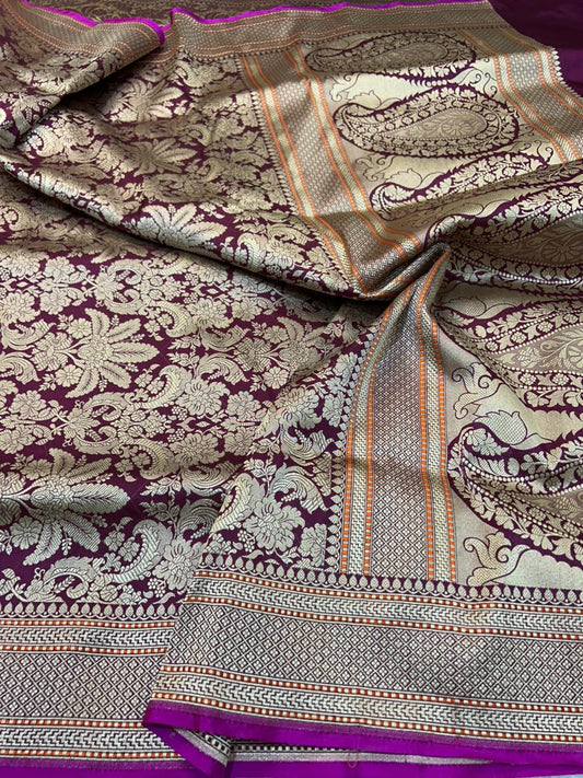 Regal Wine Banarasi Katan Silk Handloom Saree This exquisite piece is a quintessential example of Banarasi craftsmanship,