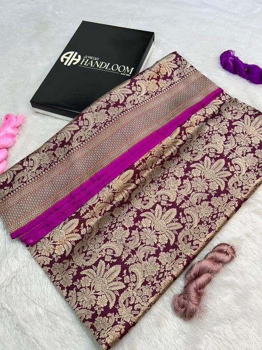 Regal Wine Banarasi Katan Silk Handloom Saree This exquisite piece is a quintessential example of Banarasi craftsmanship,